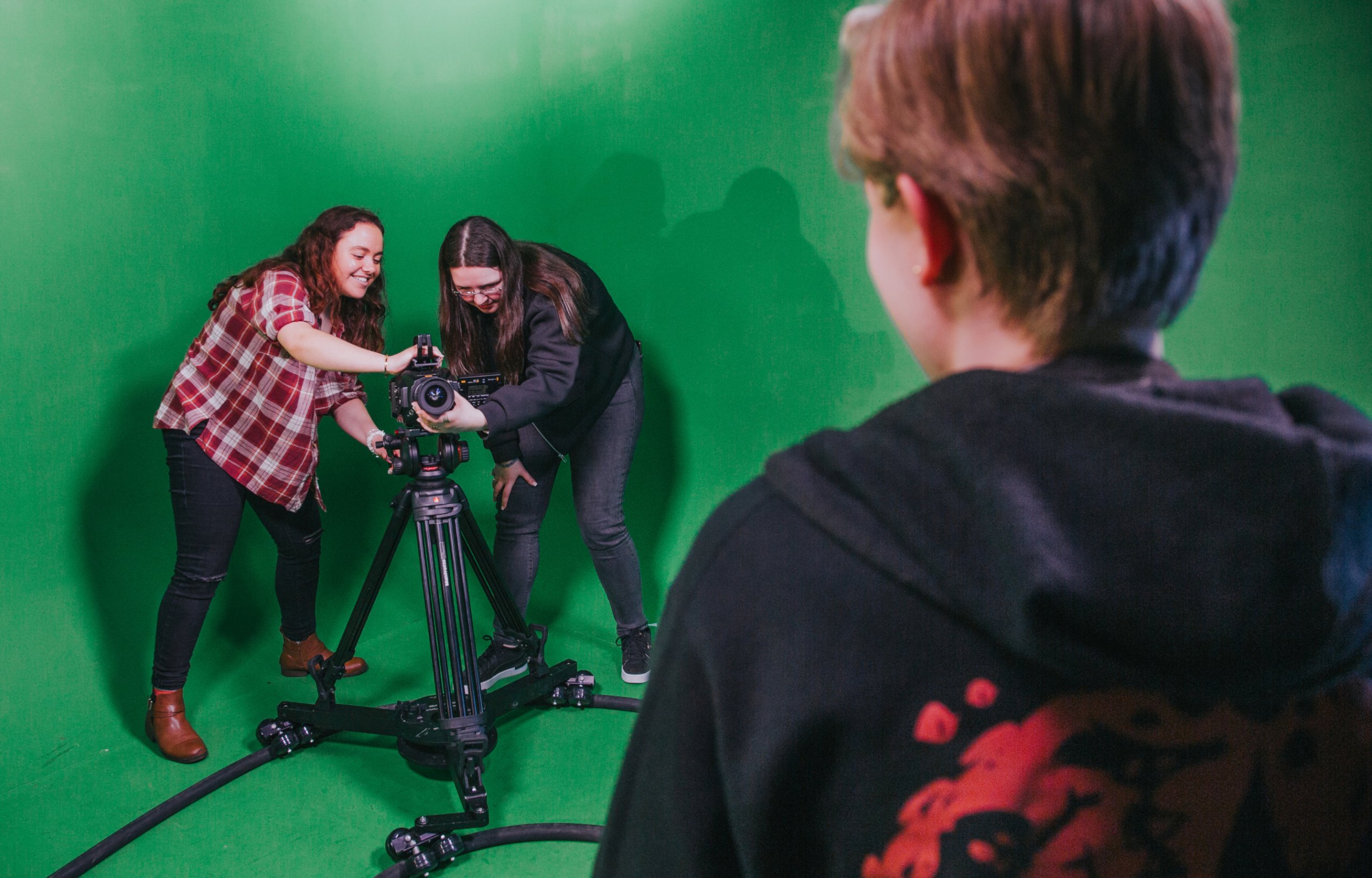 sae-liverpool-campus-3 A close-up of students filming on a camera in a film studio.